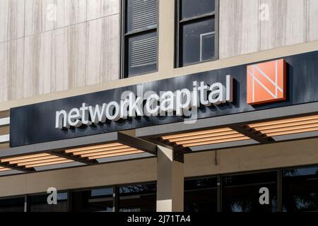 Miami, Florida, USA - January 2, 2022: Network Capital sign is shown at their regional office in Miami, Florida, USA. Stock Photo