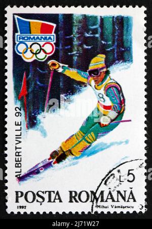 ROMANIA - CIRCA 1992: a stamp printed in the Romania shows Alpine Skiing, 1992 Winter Olympic Games, Albertville, circa 1992 Stock Photo