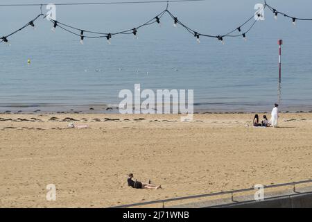 UK weather, Margate, Kent: A warm spell has started and the beach and saltwater lido at Margate are ready for visitors, with temperatures expected to reach 20c tomorrow. Sunshine, clear blue skies and calm water are already attracting people of all ages to the beach. Anna Watson/Alamy Live News Stock Photo