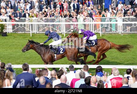 Temple of Artemis ridden by jockey Ryan Moore (left) wins the Roofing Consultants Group Handicap with Mr Alan ridden by jockey Rossa Ryan second during the Boodles May Festival Ladies Day at Chester Racecourse. Picture date: Thursday May 5, 2022. Stock Photo