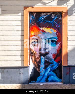 Mural depicting famous British singer, artist David Bowie with his finger to his lips in Alameda de Hércules, Seville, Andalucia, Spain