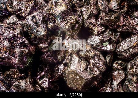 Potassium permanganate crystals under 4x magnification microscope - abstract science background Stock Photo