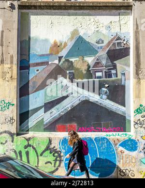The mural with houses cityscape wall in Lavapiez, Madrid featuring abstract mural work by artist Inigo Sesma. Muros Tabacalera 2019 theme - Chance Stock Photo