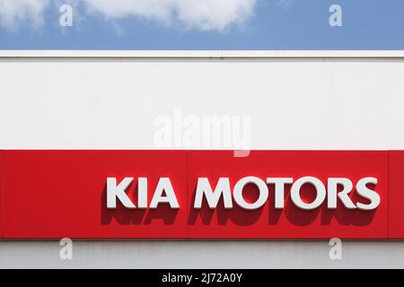 Villefranche, France - July 10, 2021: Kia Motors sign on a wall of a dealership. Kia Motors Corporation headquartered in Seoul Stock Photo