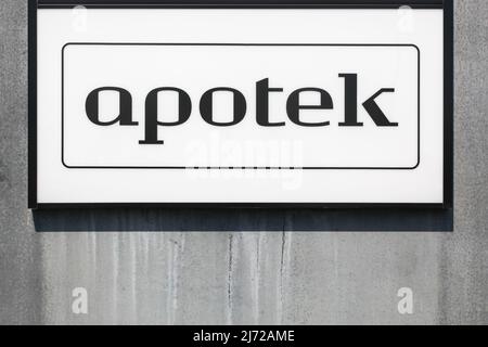 Pharmacy sign on a wall called apotek in danish language Stock Photo