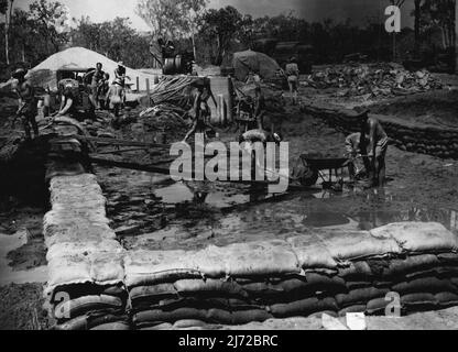 Howard Springs Darwin Water Scheme. Excavations being made in the sand bagged enclosure. February 19, 1945. (Photo by Australian Official Photo). Stock Photo