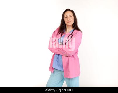 Studio shot of a smiling medical provider in scrubs with a stethoscope Stock Photo