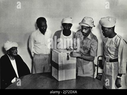 The House Of Representatives Electoral Rules, 1953 '... and seal the lid of the ballot box but shall leave the aperture open, for polling. Any candidate or polling agent may, if he so desires, put his own seal on the ballot box.' November 10, 1954. Stock Photo