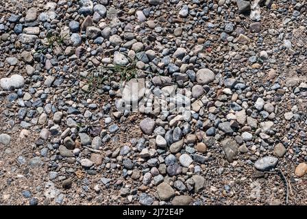 Dirt road with small stones background and texture concept Stock Photo