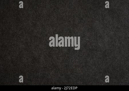 Black paper texture. Macro photography of book cover. Stock Photo