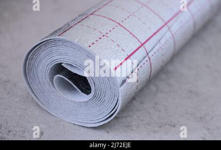 A roll of foil insulation for underfloor heating Stock Photo