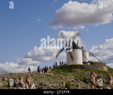 Tourists visiting famous windmills in Consuegra, Castile La Mancha, Spain, 13.04.2022. High quality photo Stock Photo