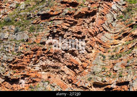 Natural Flowing Cliff Rock Face Strata Lines Stock Photo