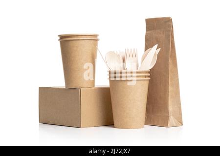 Paper cups, box and paper bag made of eco kraft paper. Wooden cutlery set. Recycling concept. Zero waste. Stock Photo