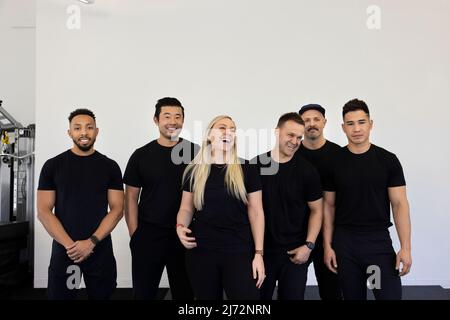 Portrait of six diverse and friendly personal trainers Stock Photo