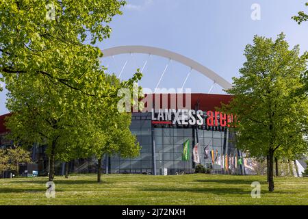 Lanxess Arena with a giant arch on top is a landmark in Cologne skyline Stock Photo