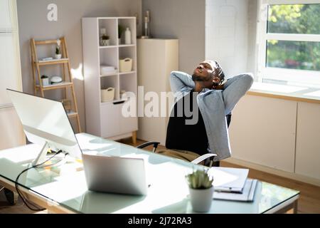Leaning Back Breathing Fresh Air From Open Window Stock Photo