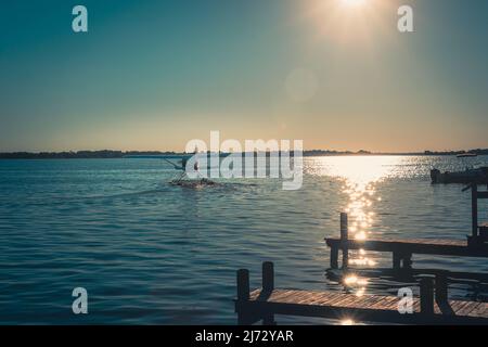 Seaplane as sun sets on Lake Dora in Mount Dora Florida Stock Photo