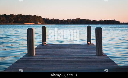 Sunset on Lake Dora dock in Mount Dora Florida Stock Photo