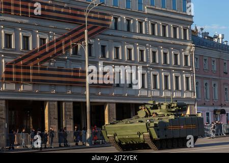 Moscow, Russia. 4th May, 2022. A T-14  Kurganets modular infantry fighting vehicle heads for Red Square during a night rehearsal for the upcoming Victory Day parade set to mark the 77th anniversary of the victory over Nazi Germany in World War II in Moscow, Russia Stock Photo