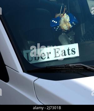 An Uber Eats car and driver making a delivery in San Francisco, California. Stock Photo