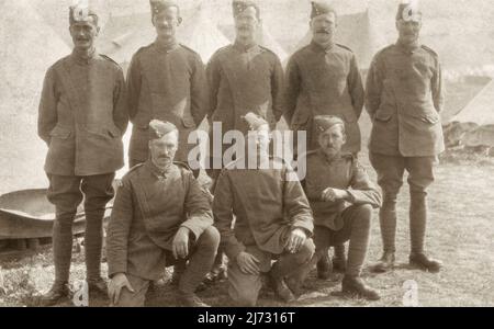 Men of the Royal Flying Corps at No.2 Balloon School of Instruction at Lydd, Kent. October 1916, during the First World War. Tents are visible in the background. The men are wearing RFC side caps and tunics, the latter, which due to its unique design was known as the ‘maternity’ pattern. Stock Photo