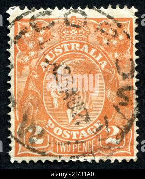 An orange 2d ‘Two Pence’ King George V Australian postage stamp. Stock Photo