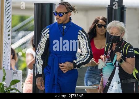 Miami, Florida, May 5, 2022. British Formula One driver Lewis Hamilton of Mercedes-AMG Petronas F1 Team and his physiotherapist and assistant Angela Cullen arrive in the paddock during the Formula One Grand Prix of Miami at the Miami International Autodrome in Miami, Florida on May 5, 2022.   Photo by Shawn Thew/UPI Stock Photo