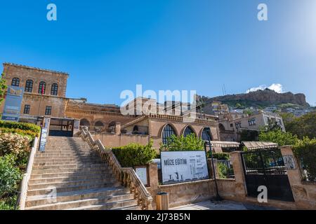 Mardin, Turkey - May 2022: Mardin museum and old town architecture and view with the castle at the top. Stock Photo