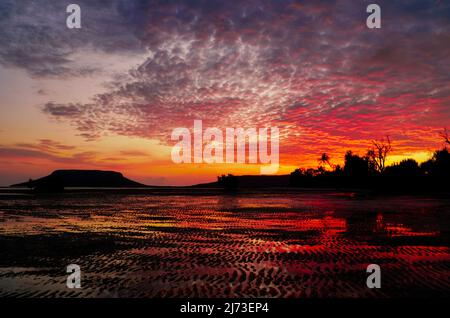 Fantastic orange sunrise at Elim Beach, Elim Beach lies roughly an hour’s drive north of Cooktown in Far North Tropical Queensland Australia Stock Photo