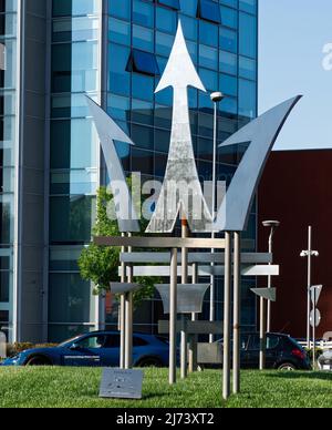 Modena - Italy - April 28, 2020: Trident Symbol of Maserati at the main entrance of Factory Headquarters. Modena, Italy. Stock Photo