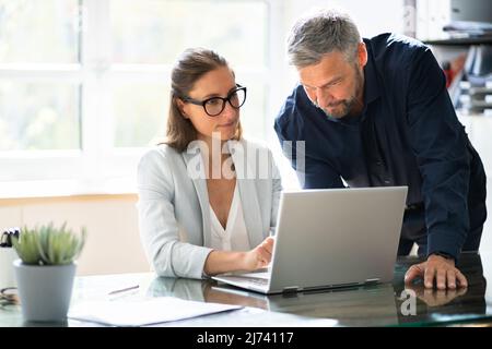 Business People Training On Computer. Young Woman In Office Stock Photo