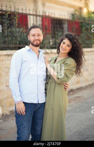 Happy couple standing outdoors Stock Photo