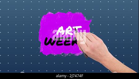 Cropped hand of caucasian man with felt tip pen over art week text on spotted background Stock Photo