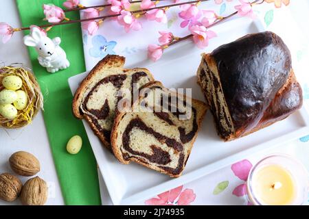 Cozonac - homemade traditional sweet bread for Easter. Easter decoration. Directly above. Stock Photo