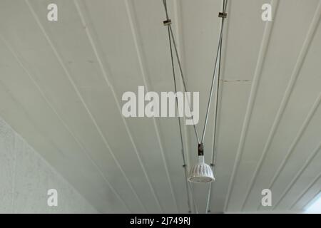 smal lamp on a white ceiling Stock Photo
