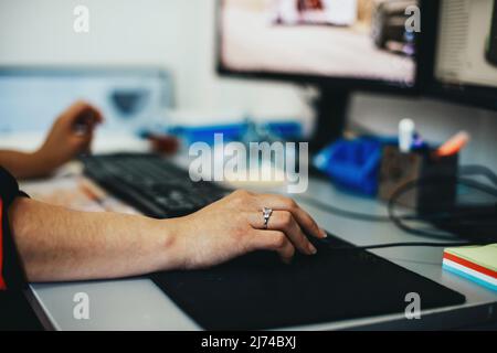close up of business woman hands typing on computer at modern startup office Stock Photo
