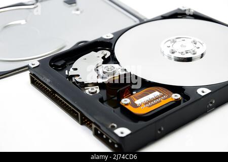 Open hard drive isolated on white background closeup. Computer hard drive HDD. computer memory. Stock Photo