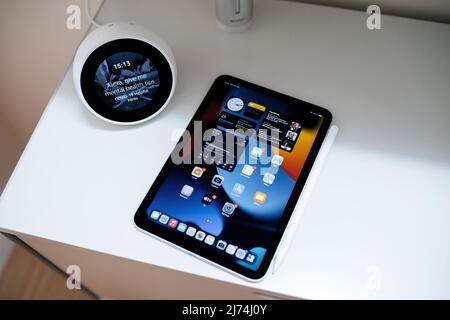 Paris, France - Oct 25, 2021: Alexa, give me metal health tips message on the Amazon Alexa next to new Apple Computers iPad mini Pro tablet Stock Photo