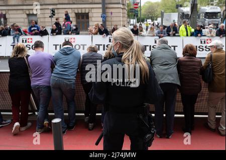 01 May 2022, Hessen, Frankfurt/Main: Cycling: UCI WorldTour - Eschborn - Frankfurt (185 km). A police officer stands at the track. Photo: Sebastian Gollnow/dpa Stock Photo