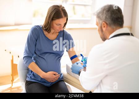 Blood Sample Collection From Pregnant Woman. Sugar Level Check Stock Photo