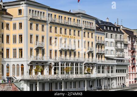 Basel, Switzerland - April 2022: Front exterior view of the luxury hotel Les Trois Rois on the waterfront of the River Rhine in the centre of Basel Stock Photo