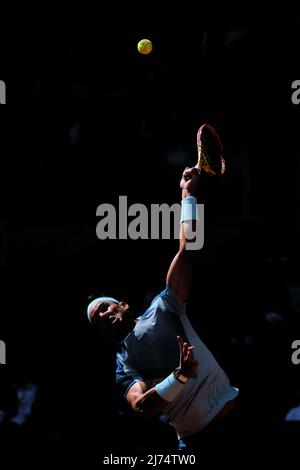 (220506) -- MADRID, May 6, 2022 (Xinhua) -- Rafael Nadal of Spain serves during the men's singles 3rd round match against David Goffin of Belgium at Madrid Open in Madrid, Spain, May 5, 2022. (Xinhua/Meng Dingbo) Stock Photo