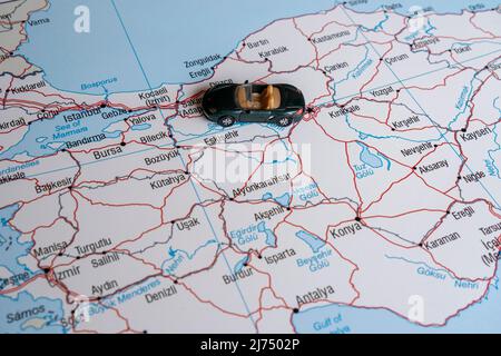 Miniature green sport car going to Istanbul, side view, toy car on Turkey map, Turkey travel concept, map idea, country tour Stock Photo