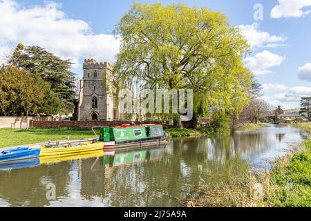 The Cotswold Canals Trust long boat Endeavour on the restored Stroudwater Canal at St Cyr's Church, Stonehouse, Gloucestershire, England UK Stock Photo