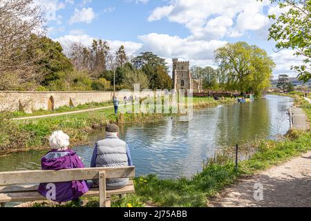 An older couple enjoying the view of the restored Stroudwater Canal at St Cyr's Church, Stonehouse, Gloucestershire, England UK Stock Photo