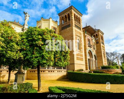 The Mudejar Pavilion designed by Anibal Gonzalez and built in 1914 houses the Museum of Arts and Popular Customs of Seville (Museo del Artes y Costumbres Populares) in Maria Luisa Park - Seville, Spain Stock Photo