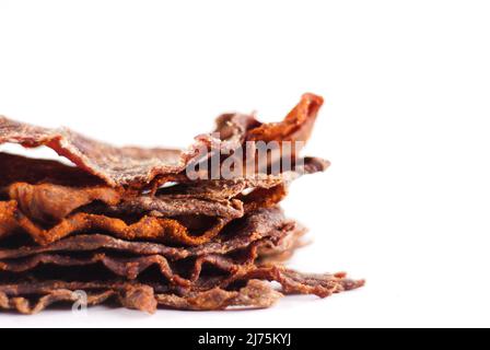 Stack of beef jerky on white Stock Photo