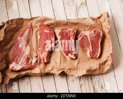 T bone steaks in parchment paper Stock Photo