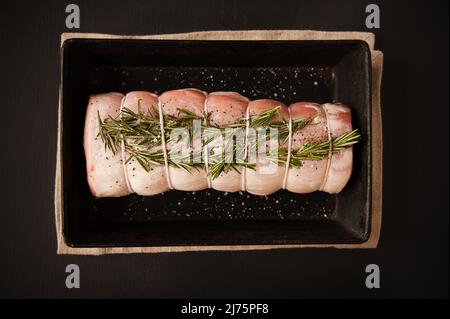 Uncooked pork roast with rosemary Stock Photo